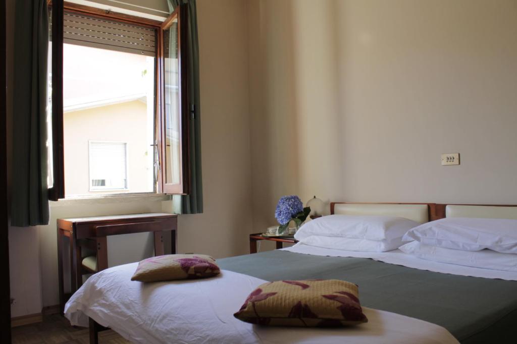 Postel nebo postele na pokoji v ubytování Hotel MariaLetizia