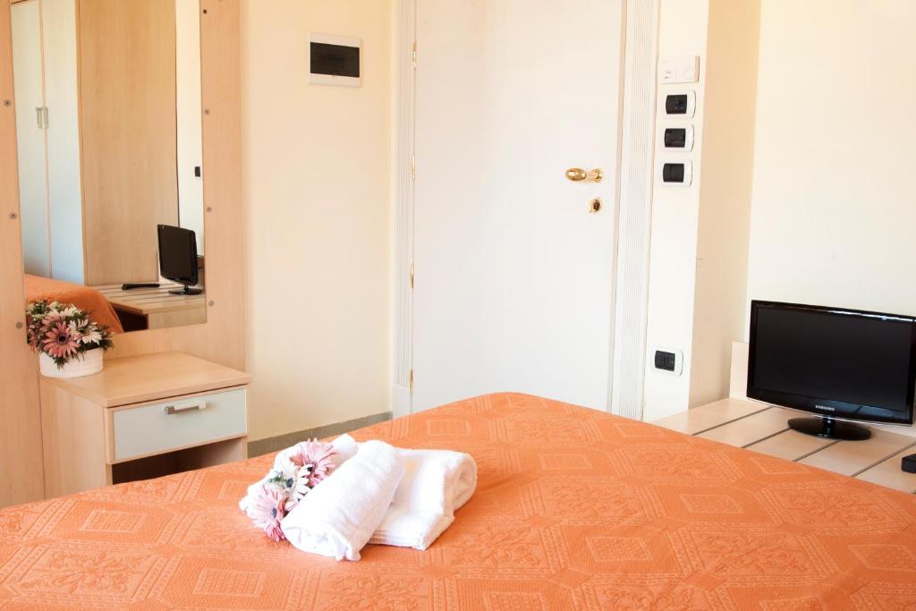 Posteľ alebo postele v izbe v ubytovaní Blu Hotel