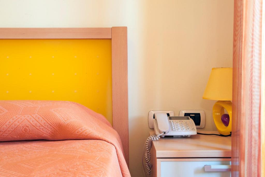 Posteľ alebo postele v izbe v ubytovaní Blu Hotel