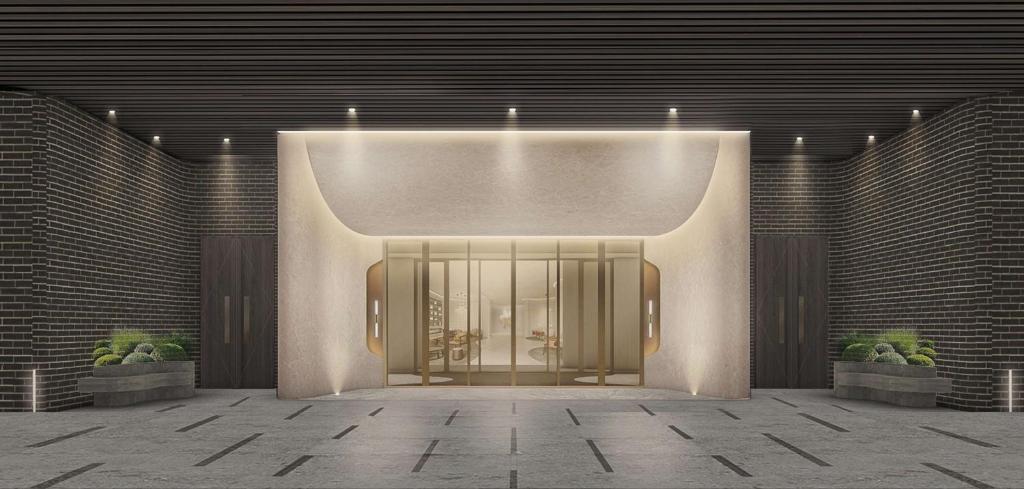 a lobby with a door and two potted plants at The Reserve Hotel Luoyang, Curio Collection By Hilton in Luoyang
