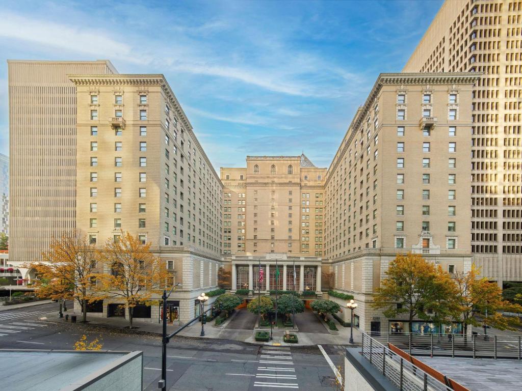 two tall buildings in a city with a street at Fairmont Olympic Hotel in Seattle