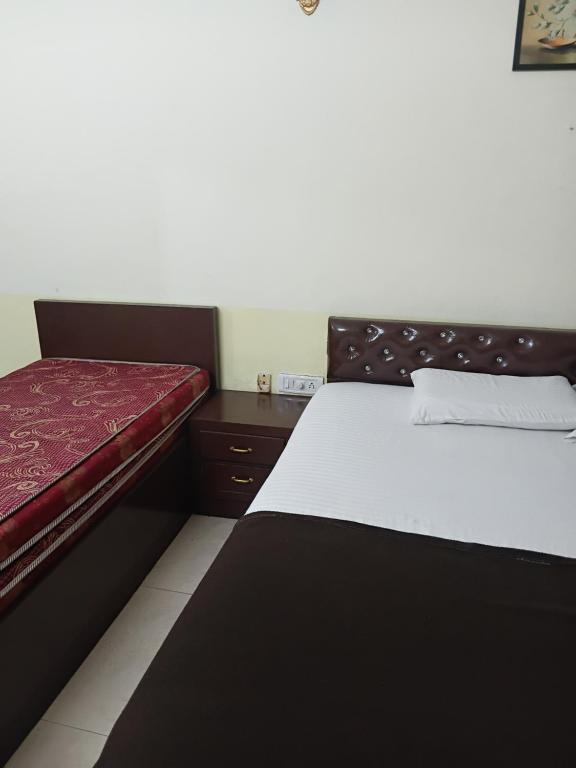 カナコナにあるCLUB Indiaのベッドルーム(ベッド2台付)