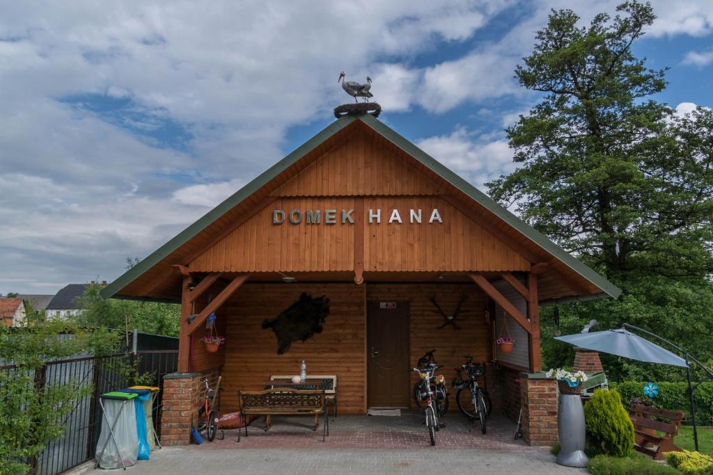 a building with a bird on the top of it at Domek HANA in Wünschelburg