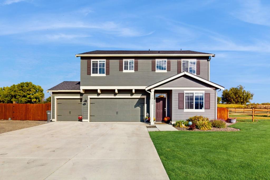 a brown house with a garage at Valley View Retreat in Ellensburg