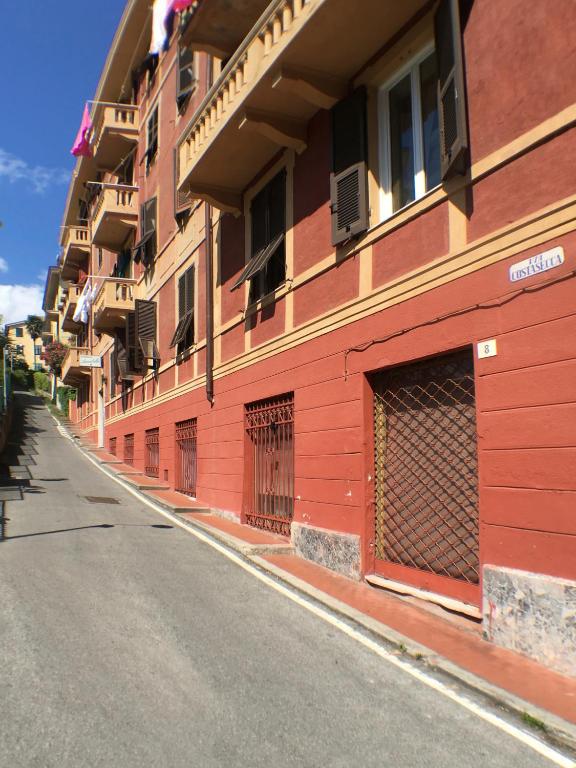 a red building on the side of a street at Albergo Annabella in Santa Margherita Ligure