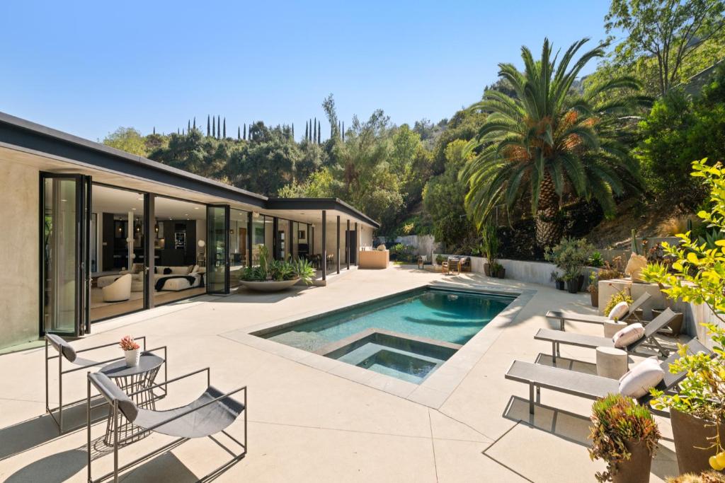 a house with a swimming pool and a patio at Valea Estate in Beverly Glen