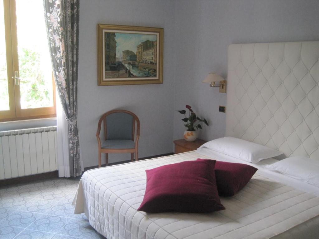 Postel nebo postele na pokoji v ubytování Hotel Gioia Garden