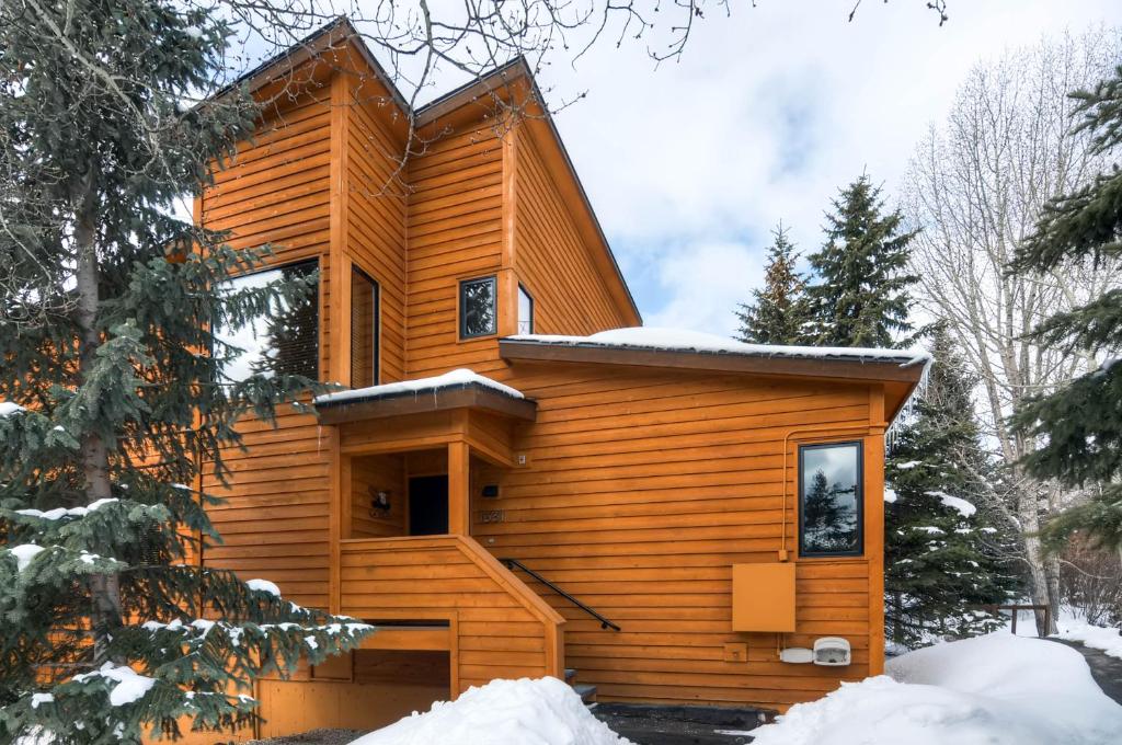 a log cabin in the woods in the snow at Aspen Ridge Condominiums by Keystone Resort in Keystone