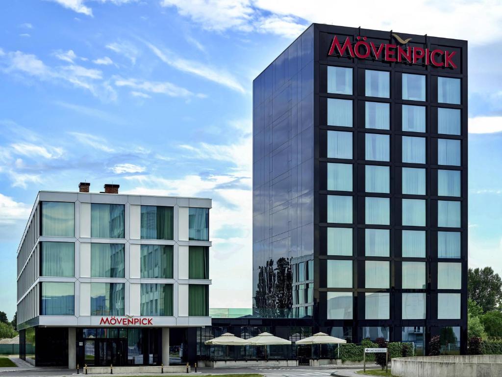 a building with a sign on the side of it at Mövenpick Zagreb in Zagreb