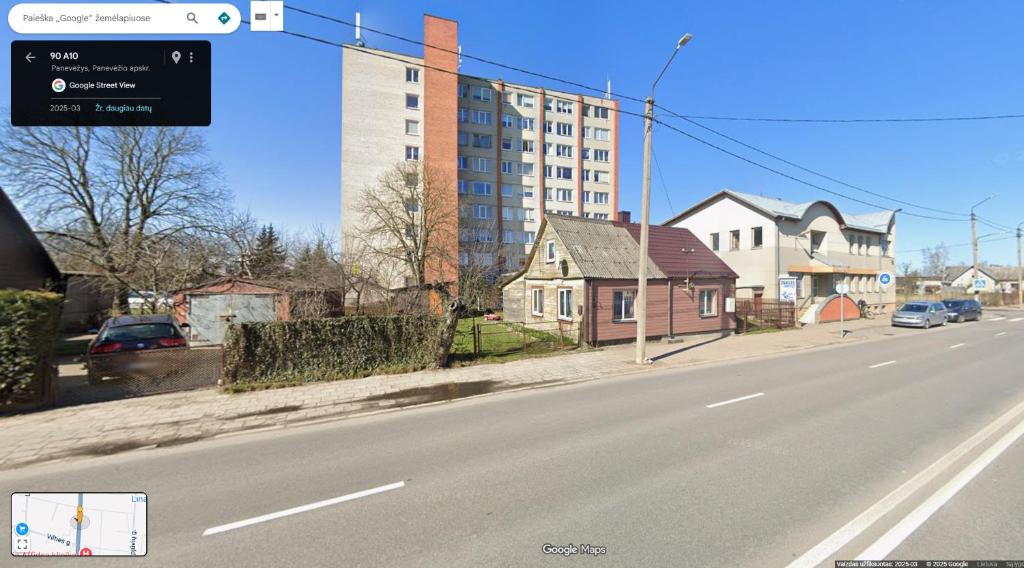 a view of a street with houses and a building at SKY Studio flat in Panevėžys