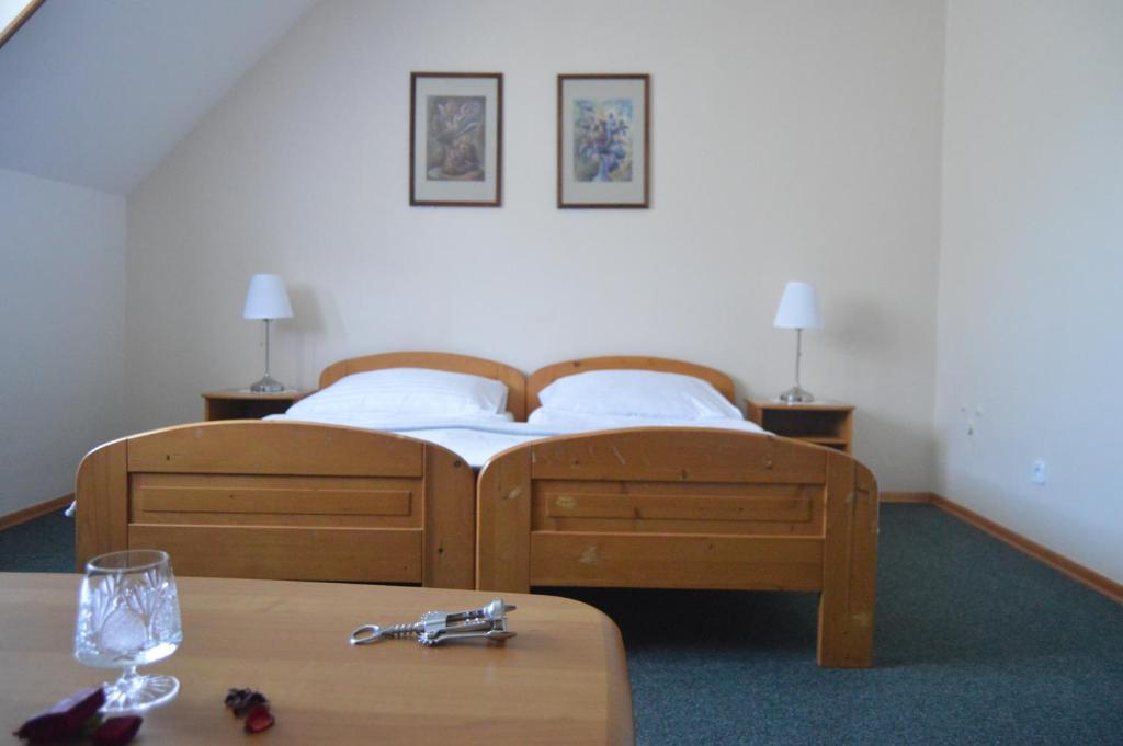 Postel nebo postele na pokoji v ubytování Motel Gombáš