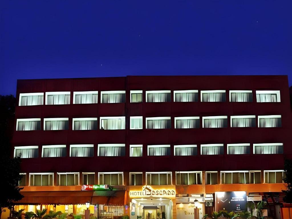 a large red building with many windows at night at Ohris Baseraa in Hyderabad