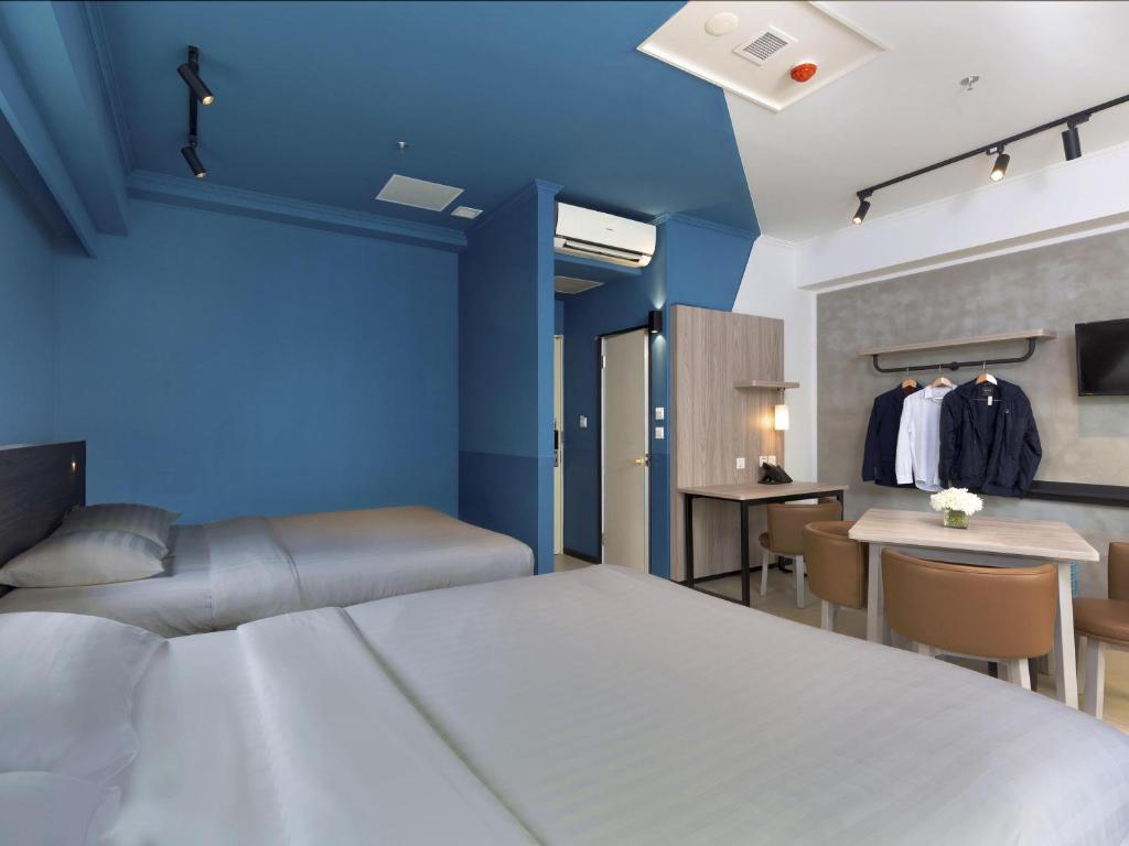 Giường trong phòng chung tại ibis budget Phnom Penh Riverside
