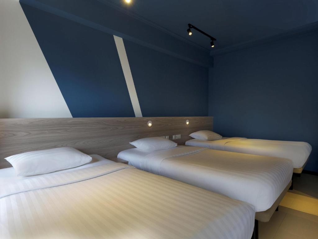 Giường trong phòng chung tại ibis budget Phnom Penh Riverside