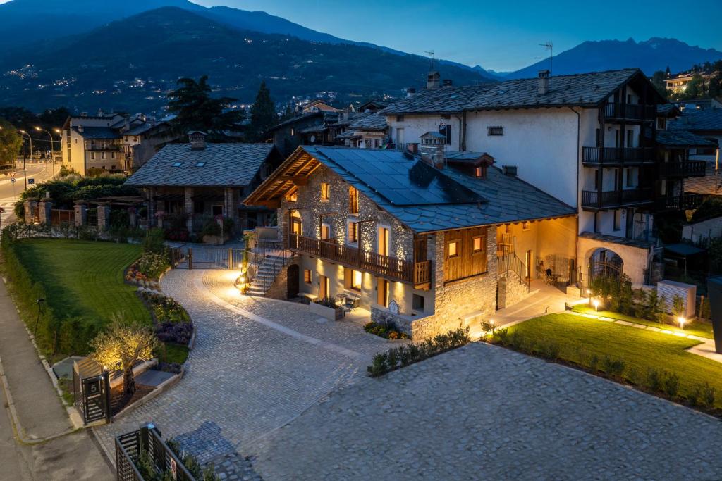 an aerial view of a house with lights at Le Grenier d'Antan - Relax Suite in Aosta