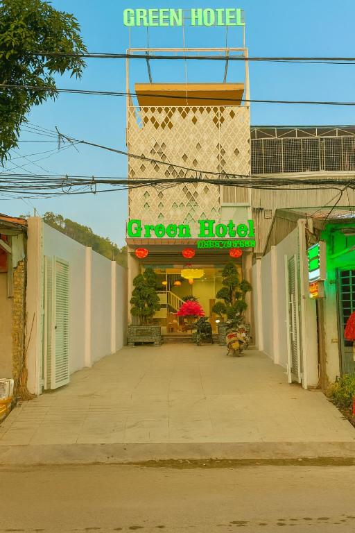 a green hotel with a green sign on a building at Green Hotel Cao Bằng in Cao Bằng