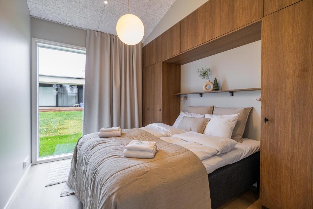 Ένα ή περισσότερα κρεβάτια σε δωμάτιο στο Villa Memory-Aurora view bath-Sauna-Lapland-Santa