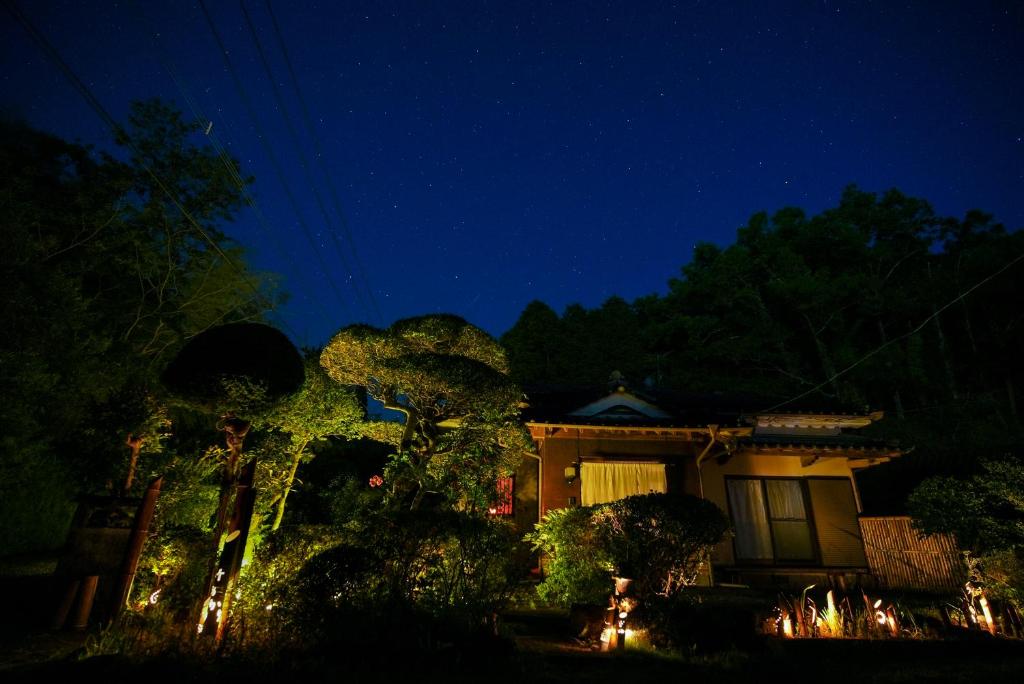 a house at night with lights in front of it at お宿竹あかりOyado Takeakari in Takachiho