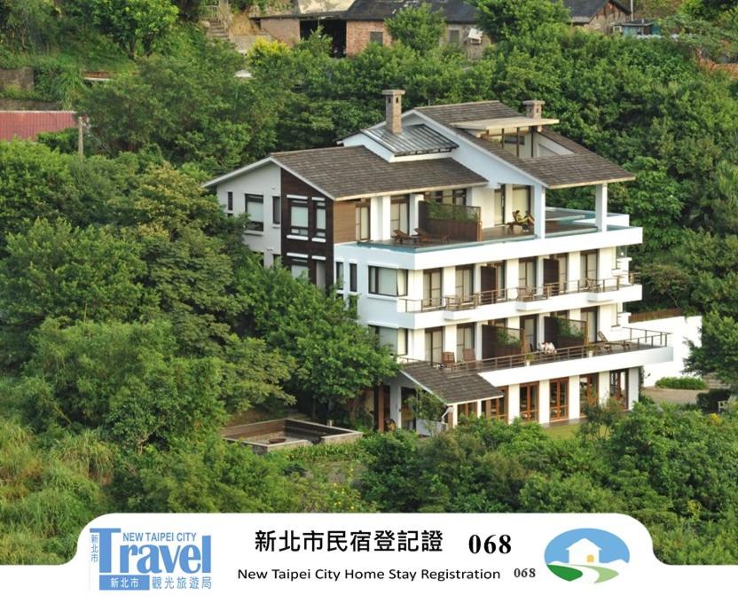 a large house on the side of a hill at Adagio JinGuaShi in Jiufen