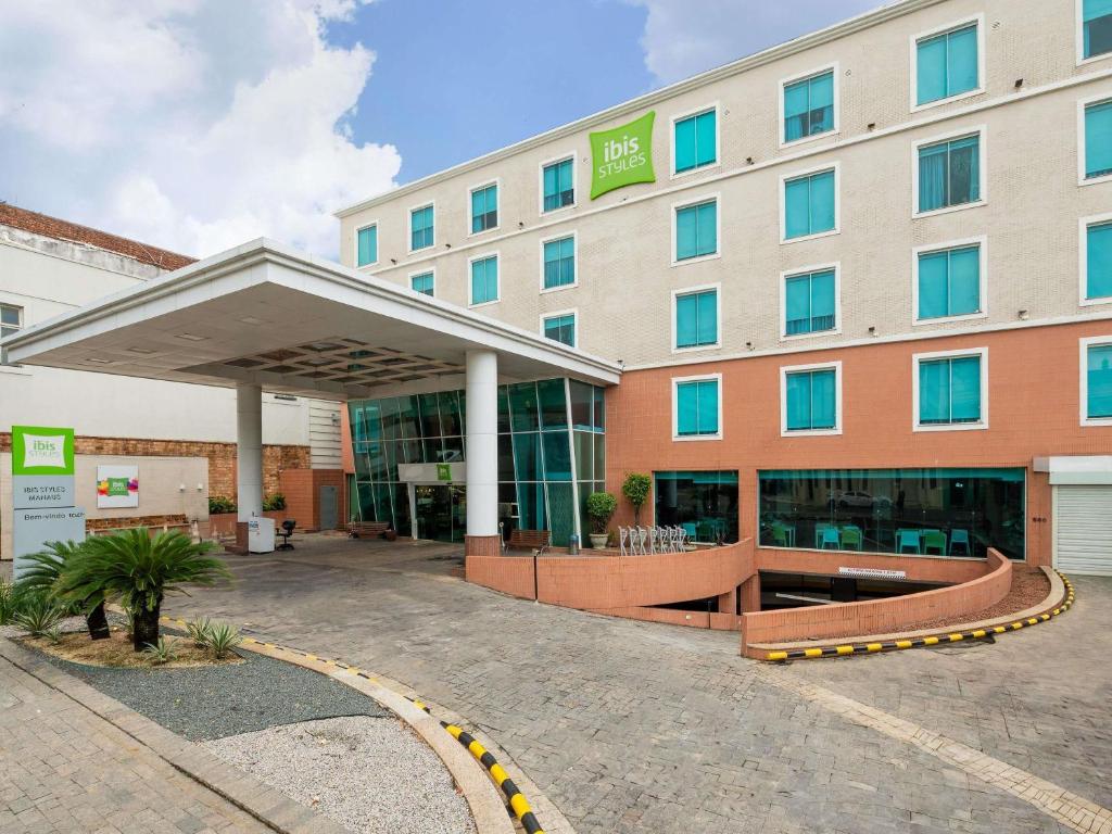 a hotel building with awning in front of it at ibis Styles Manaus in Manaus