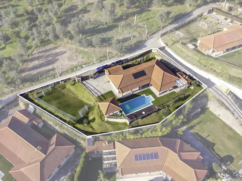 an aerial view of a house with a pool at Casa De Basto in Celorico de Basto