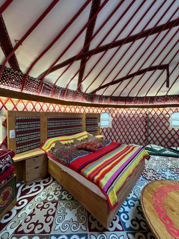 a bedroom with a bed in a tent at Aul Resort in Kaskelen