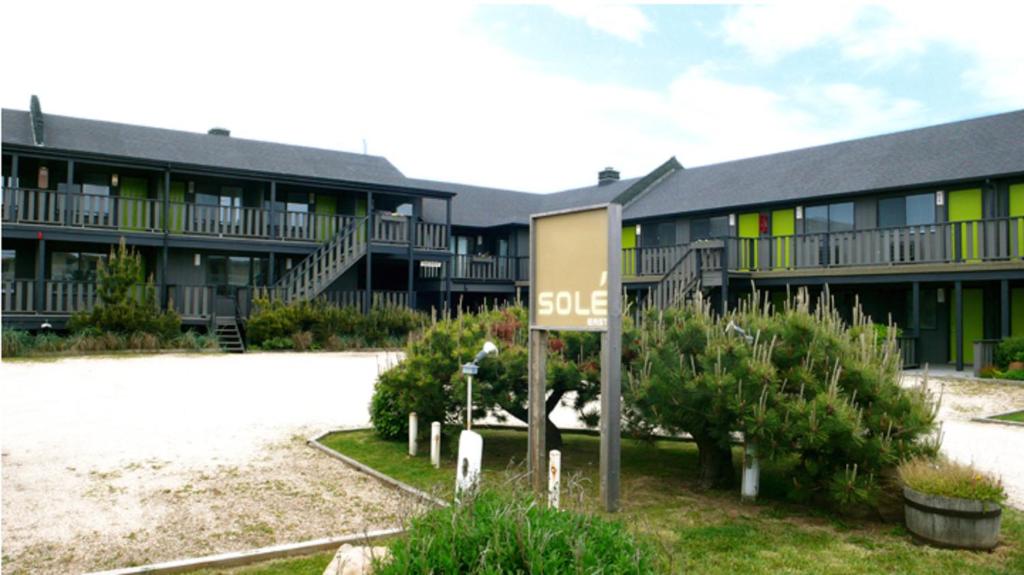 a large building with a sign in front of it at Sole East Beach in Montauk