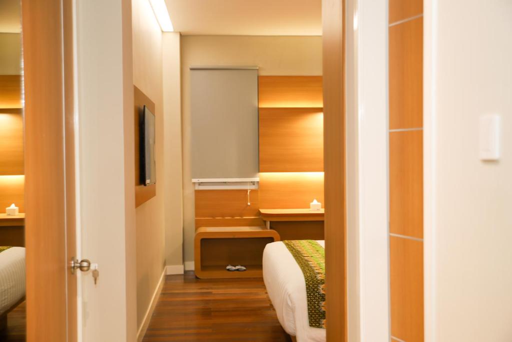 Front One Hotel Papua Lestari - Deluxe Kamer Met Kingsize Bed