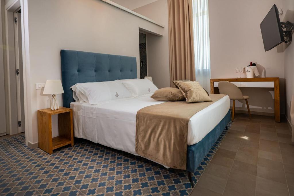 Postel nebo postele na pokoji v ubytování Tenuta Barone Resort & Spa