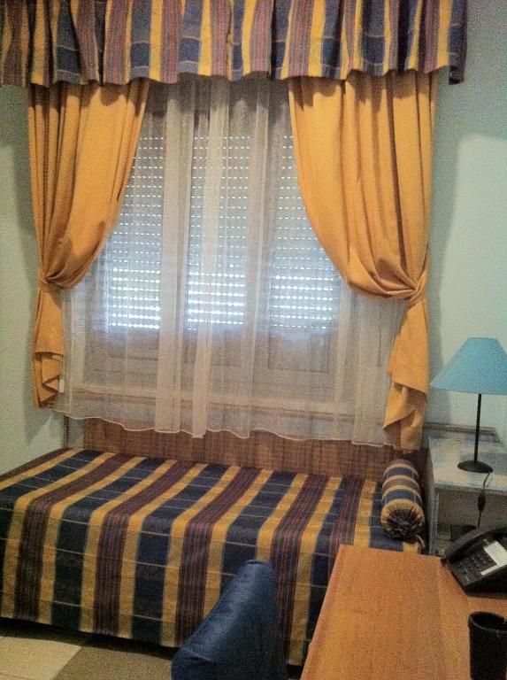 Postel nebo postele na pokoji v ubytování Hotel Morgana