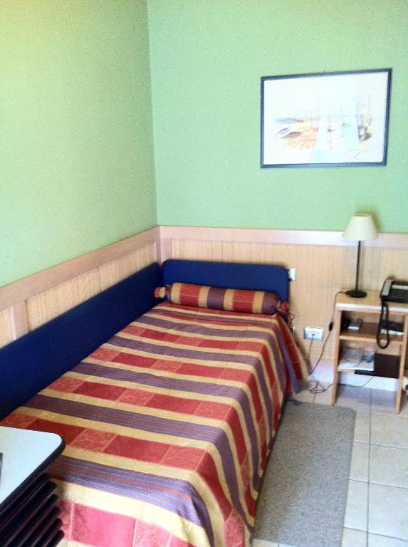 Postel nebo postele na pokoji v ubytování Hotel Morgana