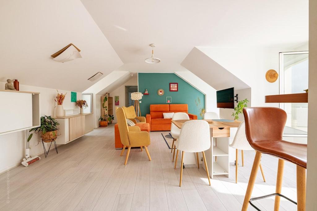 a living room with a table and chairs at Beautiful 4P accommodation - 10 min to Disney in Montévrain