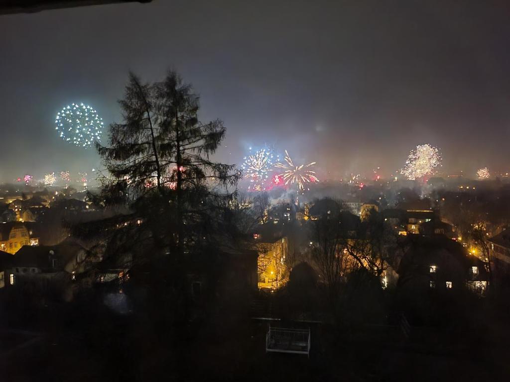 a city with fireworks in the sky at night at Blick über Dresden - Terrasse - 3 Zimmer - modern renoviert in Dresden