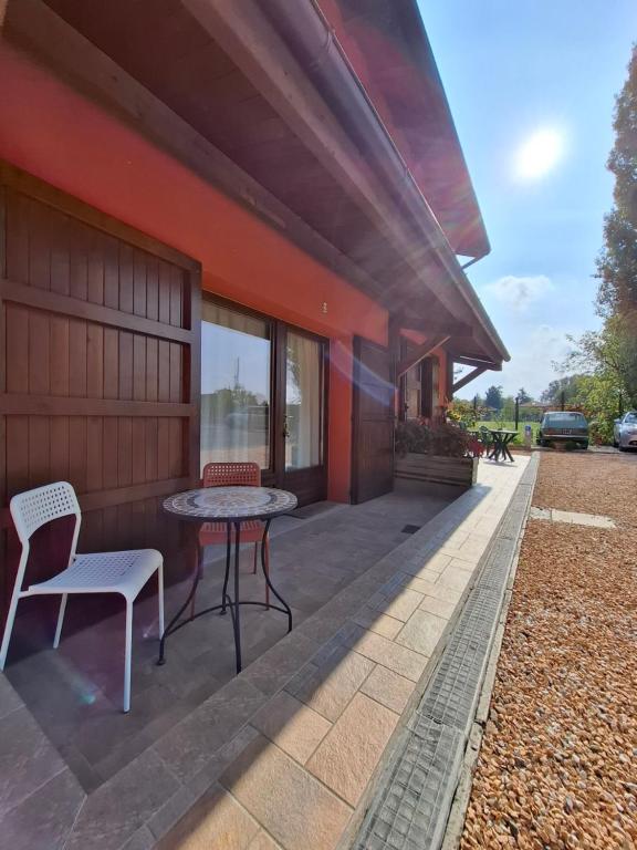 a patio with a table and chairs next to a building at TartaRigo b&b in Bologna