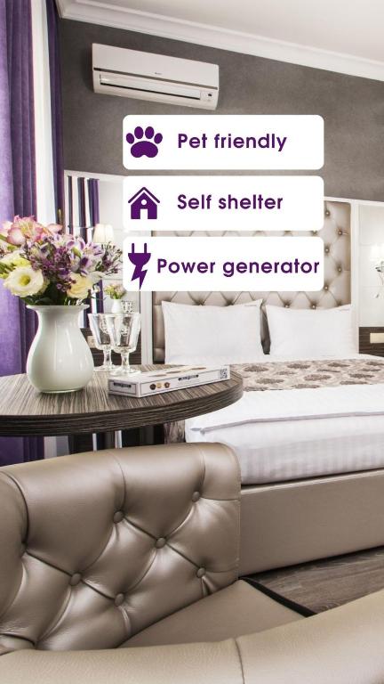 a bedroom with a bed and a table with flowers at BonApart Hotel by UHM in Kyiv