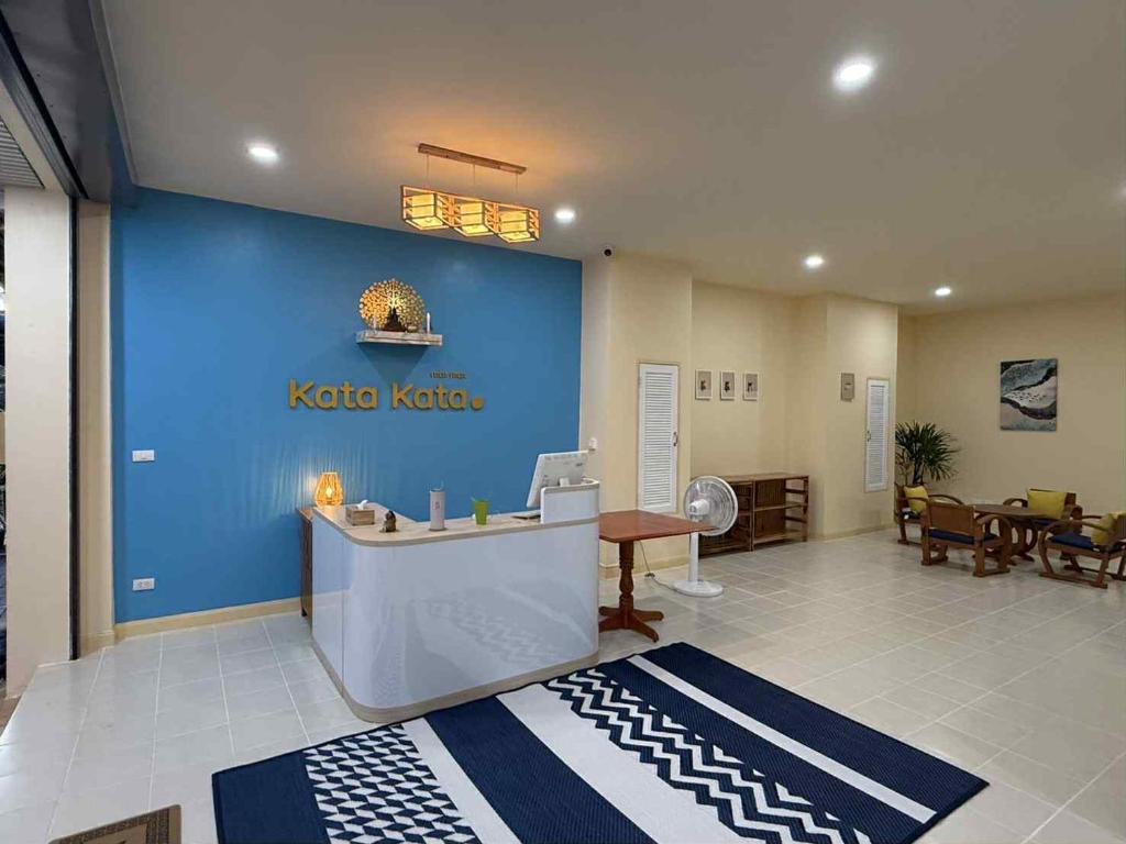 a hospital lobby with a kocho noda sign on the wall at Kata Kata Stay in Kata Beach