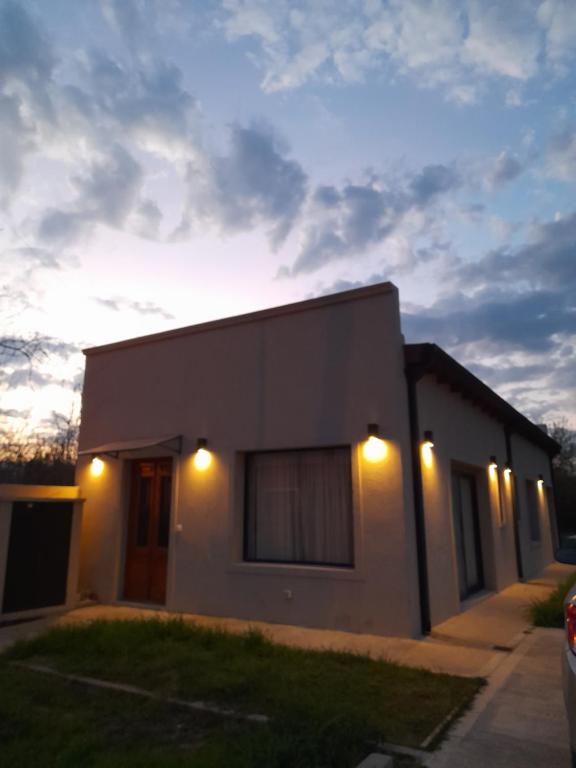 a house with lights on the side of it at El Renacer Duggan in Duggan