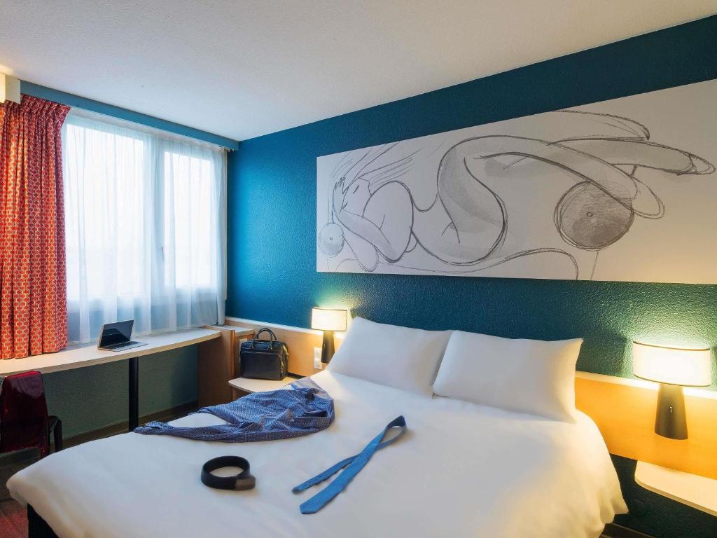 Postel nebo postele na pokoji v ubytování ibis Tours Nord