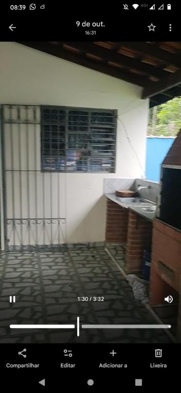 a view of a living room with a window at Casa tranquila Itanhaém in Itanhaém