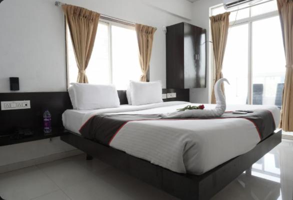 Ένα ή περισσότερα κρεβάτια σε δωμάτιο στο Basil Inn