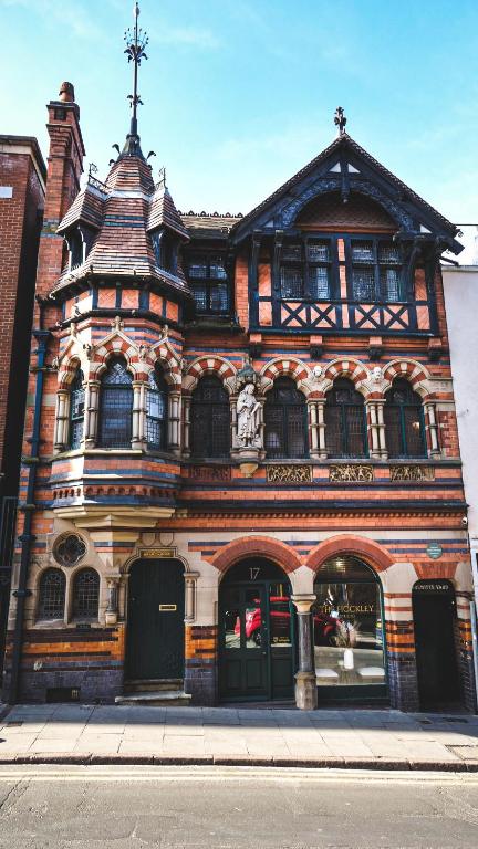 an old building with a cross on top of it at Fothergill House - Entire Luxury Townhouse - City Centre in Nottingham