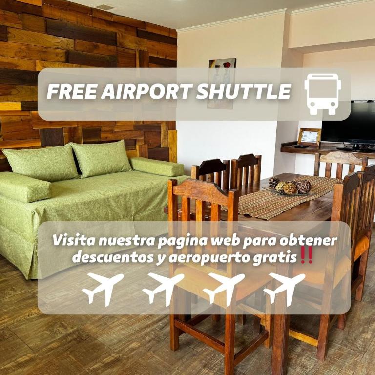 a living room with a couch and a table and chairs at Patagonia Austral Suites - Cabaña con servicio de hotel - DESAYUNO INCLUIDO! in El Calafate