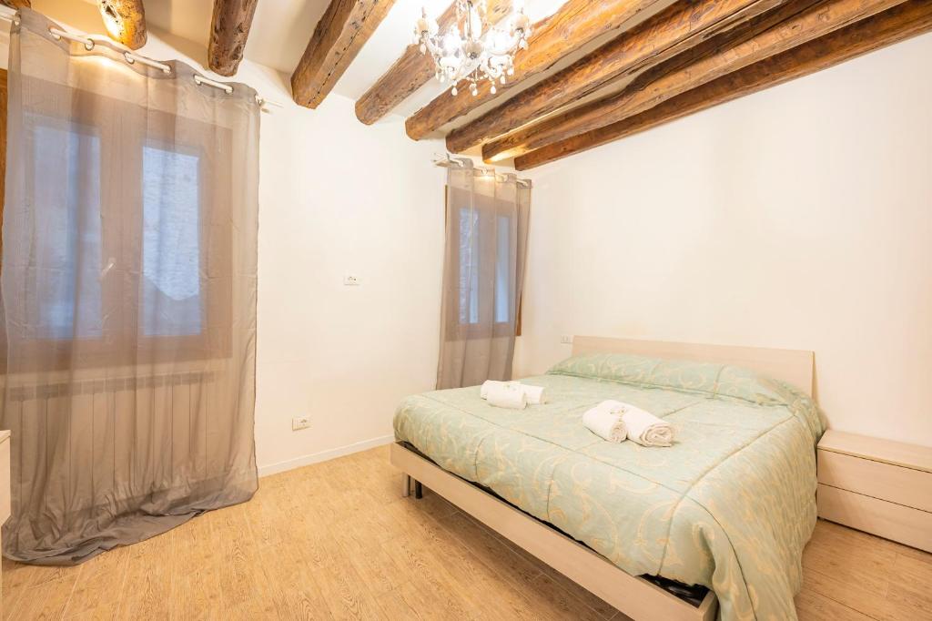 Ένα ή περισσότερα κρεβάτια σε δωμάτιο στο San Marco Suite - 5 min da San Marco