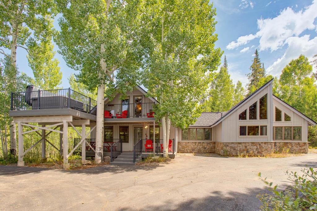 a house with a wrap around porch and a balcony at Mtn-View Deck Stunning Fraser Home By Ski Shuttle in Maryvale