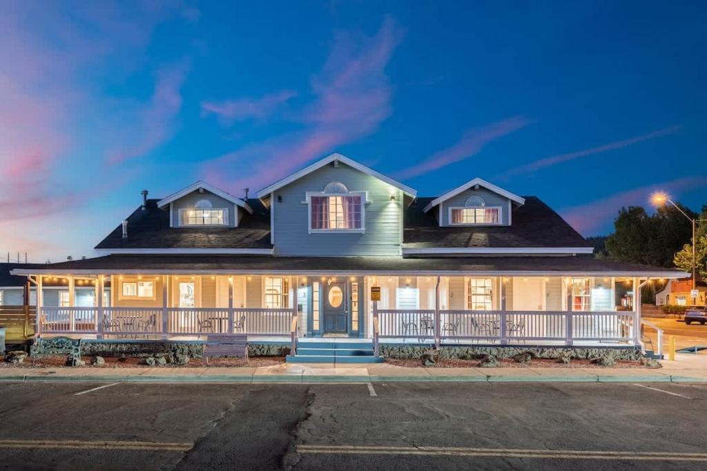 a large house with a front porch at night at The Cowboy Social Unit 10 in Williams