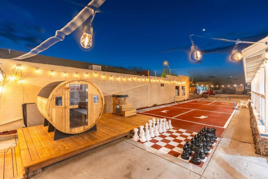 a ping pong court with a chess board and lights at The Cowboy Social Unit 14 in Williams