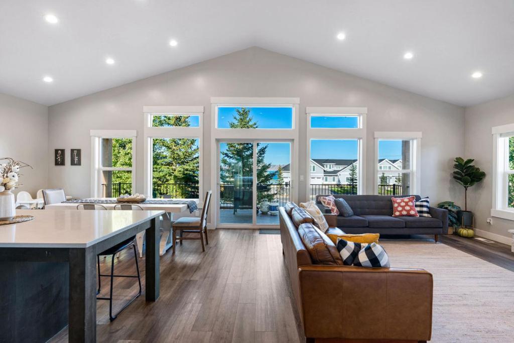 a kitchen and living room with a table and chairs at Boardwalk in Garden City