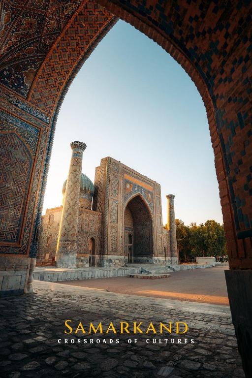 an archway in front of a building at Mumtoz Hotel in Samarkand