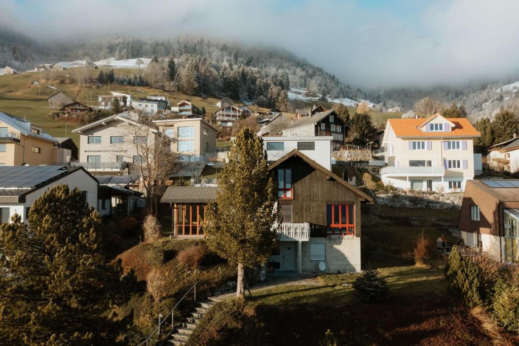 a village on a hill with houses at Apartment Kleines Daheim in Amden