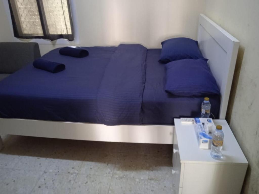 Ένα ή περισσότερα κρεβάτια σε δωμάτιο στο Northfield Studio Apartments